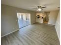 Living room with vinyl flooring and sliding doors leading to a patio at 5205 Landsman Ave, Tampa, FL 33625