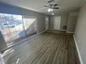 Bright living room featuring neutral walls and laminate flooring at 5205 Landsman Ave, Tampa, FL 33625