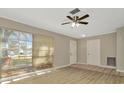 Inviting living room filled with natural light and neutral tones, perfect for comfortable living and entertaining at 5205 Landsman Ave, Tampa, FL 33625