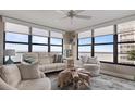 Bright living room with ocean views, comfy seating, and stylish decor at 629 Alhambra Rd # 604, Venice, FL 34285