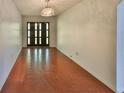 Bright entryway with red brick tile flooring and double doors at 816 Knight St, Seffner, FL 33584