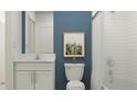 Bathroom with white subway tiles, a white vanity, and a shower/tub combo at 8418 Bella Mar Trl, Parrish, FL 34219