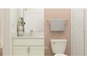 Small bathroom with white vanity, shower, and toilet at 9389 Runaway Breeze Dr, Land O Lakes, FL 34637