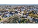 Wide aerial view of a residential neighborhood with houses and streets at 10214 Turtle Hill Ct, Tampa, FL 33615