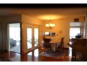 Bright dining room with wood floors and access to patio at 10611 Fairfield Village Dr, Tampa, FL 33624