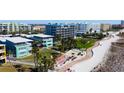 Aerial view of a beachside community with lush landscaping and walkway at 11730 Gulf Blvd # 49, St Petersburg, FL 33706