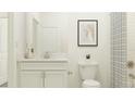 Simple bathroom with white vanity and shower at 11866 Sparkling Topaz Cv, Parrish, FL 34219