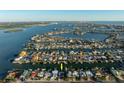 Aerial view of waterfront home with boat access at 129 Wall St, Redington Shores, FL 33708