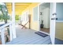 Relaxing front porch with seating and a welcome mat at 1913 E Wilder Ave, Tampa, FL 33610