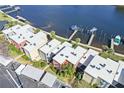 Aerial view of waterfront condo building with boat slips at 2424 W Tampa Bay Blvd # C212, Tampa, FL 33607