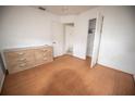 Bedroom with dresser, hardwood floors, and closet at 2480 18Th N Ave, St Petersburg, FL 33713