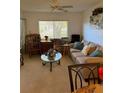 Bright living room featuring comfy seating and a coffee table at 3115 Mission Grove Dr, Palm Harbor, FL 34684