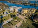 Two modern waterfront homes with nicely landscaped yards at 335 Bath Club S Blvd, North Redington Beach, FL 33708