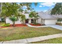 Single-story house with a landscaped yard and driveway at 4604 Westford Cir, Tampa, FL 33618