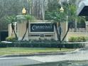 Oxford Place at Tampa Palms condominium community entrance sign featuring palm trees and manicured landscaping at 5125 Palm Springs Blvd # 10303, Tampa, FL 33647