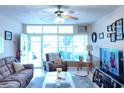 Spacious living room with ample natural light and comfy seating at 5745 40Th N Ave # 152B, St Petersburg, FL 33709