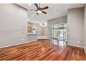 Bright and airy living room with hardwood floors and sliding doors at 6944 Runner Oak Dr, Wesley Chapel, FL 33545