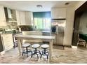 Modern kitchen with stainless steel appliances and island at 895 64Th S Ave, St Petersburg, FL 33705