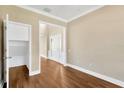 Hardwood floor office with access to hallway and storage at 10112 Haverhill Ridge Dr, Riverview, FL 33578