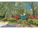 Gated entrance to the community with landscaping and signage at 16218 Swenson Ter, Lutz, FL 33549