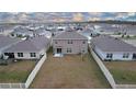 Aerial view of the house and backyard, showing a large fenced area at 16779 Sunburst Lake St, Wimauma, FL 33598