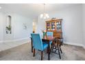 Dining area with wooden table and chairs, and a hutch at 19724 Post Island Loop, Land O Lakes, FL 34638