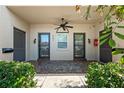 Condo entry with three doors and a tiled floor at 301 Cordova Grn, Seminole, FL 33777