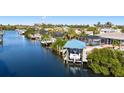 Waterfront property with private boat dock and community canal views at 6518 Senegal Palm Way, Apollo Beach, FL 33572