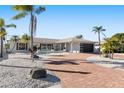 Attractive single-story home with a modern garage door and landscaped yard at 6518 Senegal Palm Way, Apollo Beach, FL 33572