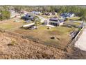Aerial view of house, expansive backyard, and surrounding homes at 8131 Spring Forest Ln, Wesley Chapel, FL 33544