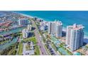 Aerial view of condo building, beach, and surrounding area at 1540 Gulf Blvd # 2004, Clearwater, FL 33767