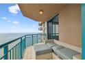 Spacious condo balcony overlooking the ocean with comfortable seating at 1540 Gulf Blvd # 2004, Clearwater, FL 33767