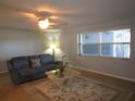 Spacious living room with large windows and a relaxing atmosphere at 1950 59Th N Ave # 110, St Petersburg, FL 33714