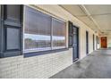 Building hallway with apartment doors and windows at 2 N Fernwood Ave # 16, Clearwater, FL 33765