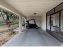 Covered parking area for golf cart at 2022 Hawkhurst Cir, Sun City Center, FL 33573