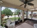 Relaxing screened porch with wicker chair at 2022 Hawkhurst Cir, Sun City Center, FL 33573