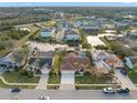 Aerial view showing house, pool, and surrounding homes at 3190 Shoreline Dr, Clearwater, FL 33760