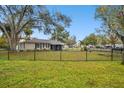 House exterior with a black metal fence at 3915 W Pearl Ave, Tampa, FL 33611