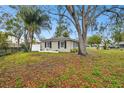 Side yard view of a single-story home at 3915 W Pearl Ave, Tampa, FL 33611