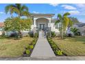 Bright and airy home exterior with manicured landscaping and welcoming entrance at 3925 1St Ne St, St Petersburg, FL 33703