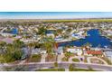 Aerial view of a waterfront home with canal access and lush landscaping at 4730 Shore Acres Ne Blvd, St Petersburg, FL 33703