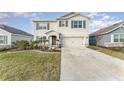 Two-story house with gray shutters and stone accents at 5130 Adega Way, Bradenton, FL 34211