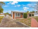 Brick ranch home with a walkway and mature trees at 5290 38Th S Way, St Petersburg, FL 33711