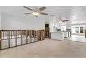 Open-concept space with a ceiling fans, a kitchen island, and mosaic tile backsplash at 5600 Bayou Grande Ne Blvd, St Petersburg, FL 33703