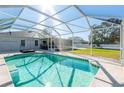 Relaxing screened-in pool area, perfect for outdoor enjoyment at 6516 Clair Shore Dr, Apollo Beach, FL 33572