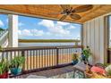 Relaxing balcony with water views, ceiling fan and comfy seating at 813 Bahia Del Sol Dr # 33, Ruskin, FL 33570