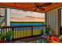 Balcony with sunset view over the water, ceiling fan and seating at 813 Bahia Del Sol Dr # 33, Ruskin, FL 33570