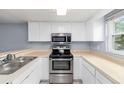 Kitchen with stainless steel appliances at 10061 Lake Oak Cir, Tampa, FL 33624