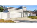 Gray house with white garage door and fence at 1103 S Prospect Ave, Clearwater, FL 33756