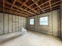 Unfinished bathroom with exposed framing and a toilet at 1151 Rue Des Chateaux, St Petersburg, FL 33707